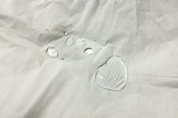 Tissue sprayed with waterproof spray